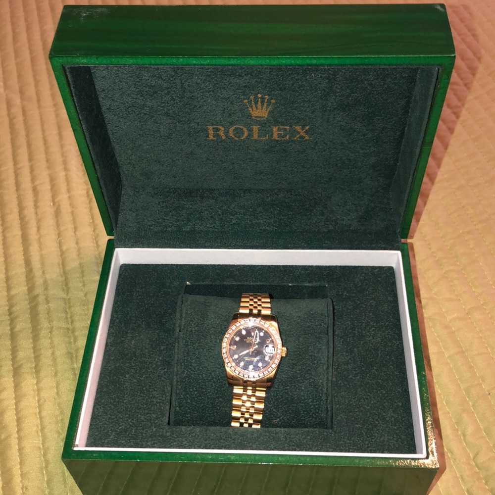 Worn a handful of times, black and gold Rolex